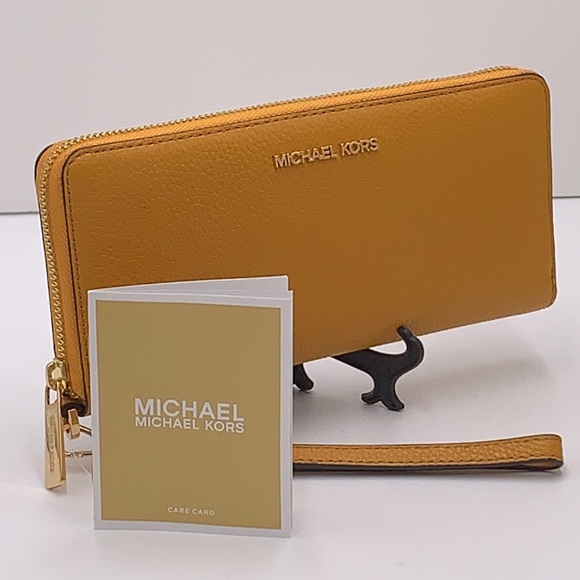 Michael Kors Handbags - MICHAEL KORS LARGE TRAVEL CONTINENTAL WRISTLET WALLET MARIGOLD COLOR
NWT
